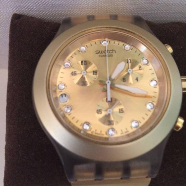 Relógio dourado Swatch