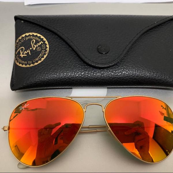 culos rayban laranja espelhado