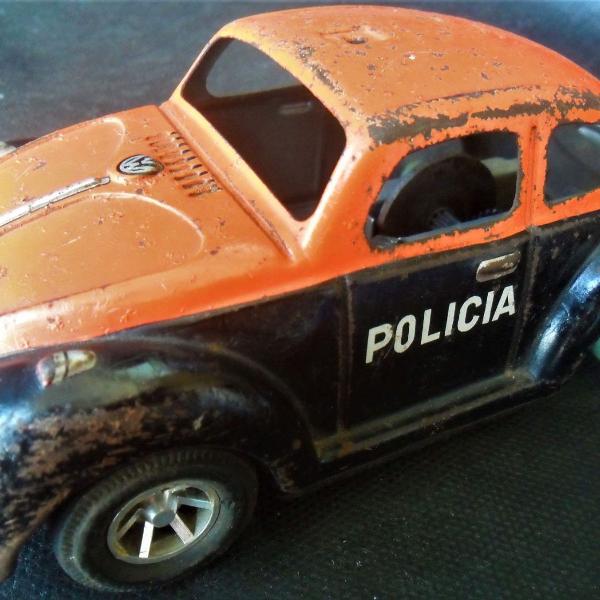 antigo fusca de brinquedo da policia militar ´´força