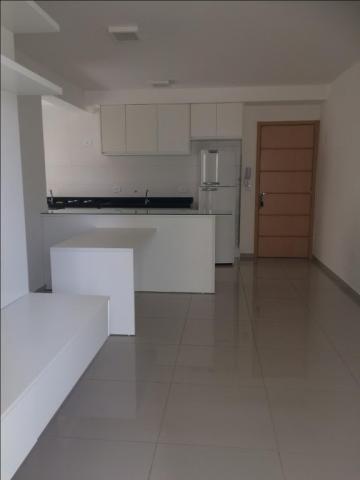 Apartamento com 2 dormitórios para alugar, 67 m² por R$