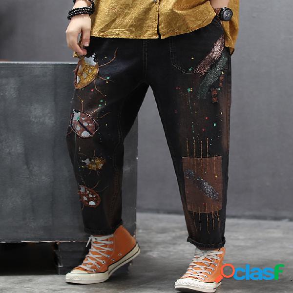 A cintura bordada remendo do cordão rasgou Jeans para