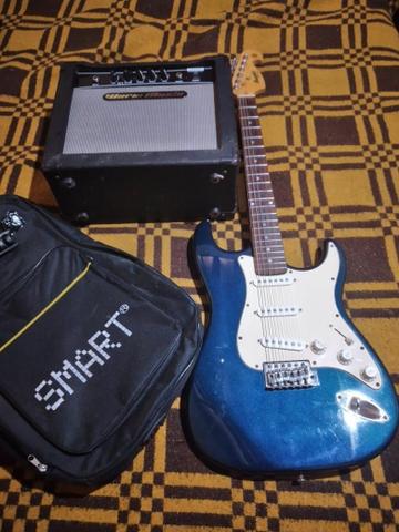 Uma guitarra e caixa amplificada