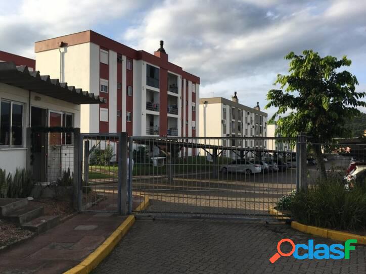 APARTAMENTO COM SACADA E CHURRASQUEIRA